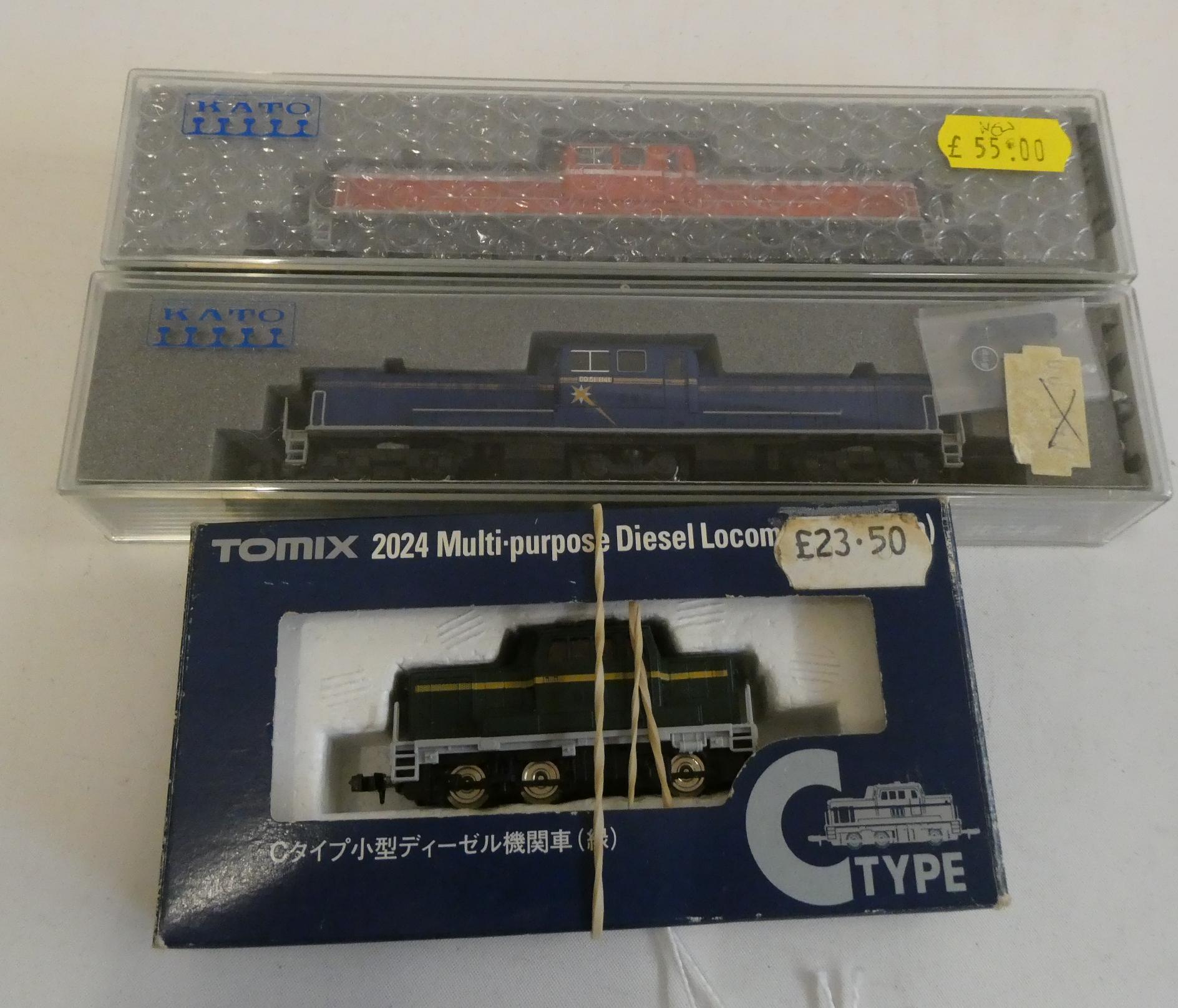 KATO Japanese N gauge DD51 diesel in blue, DD51 diesel in red and TOMIX C. type diesel in green, all Image