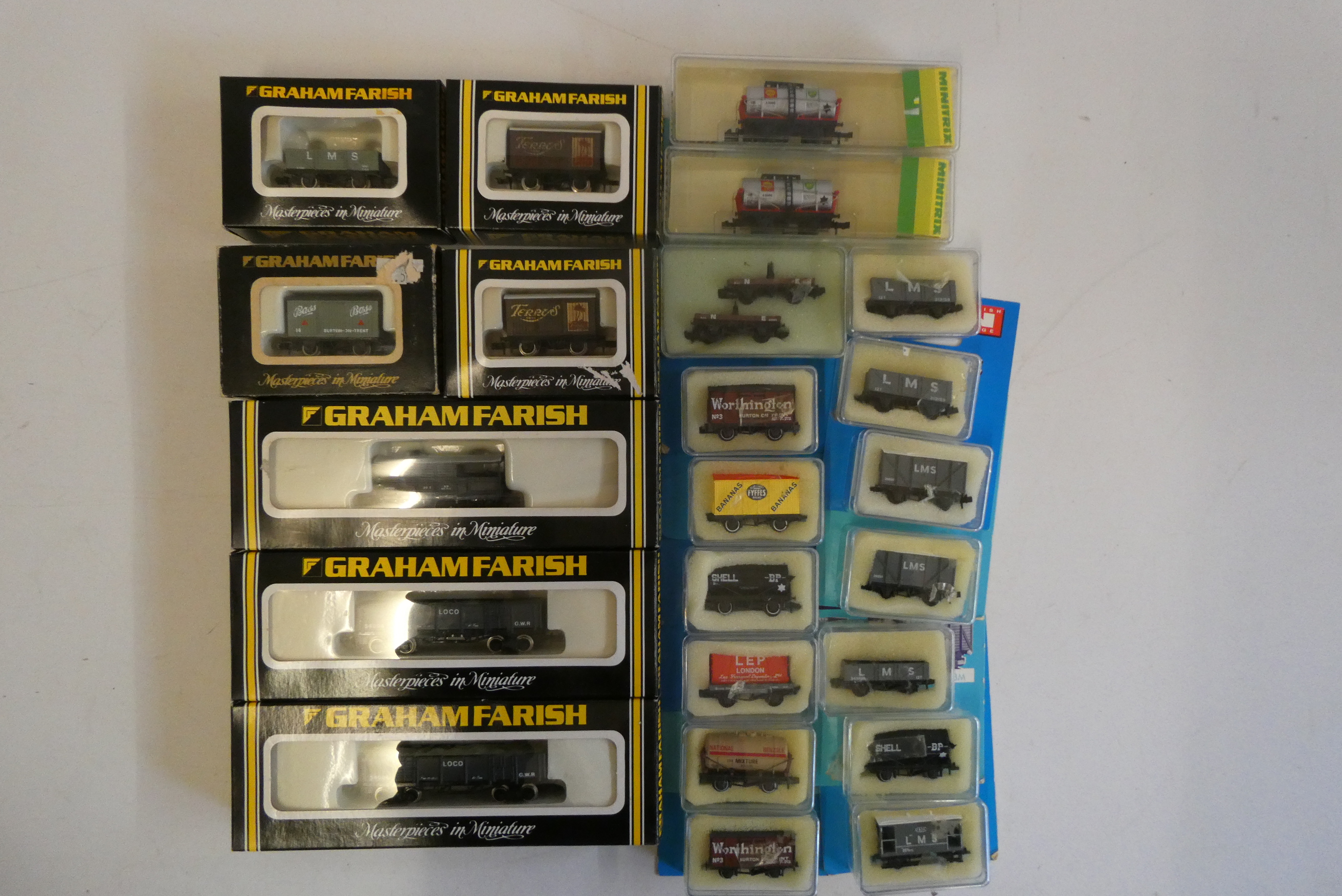 Twenty-two N gauge steam era goods wagons by Minitrix, Peco and Graham Farish, boxed, good to Image