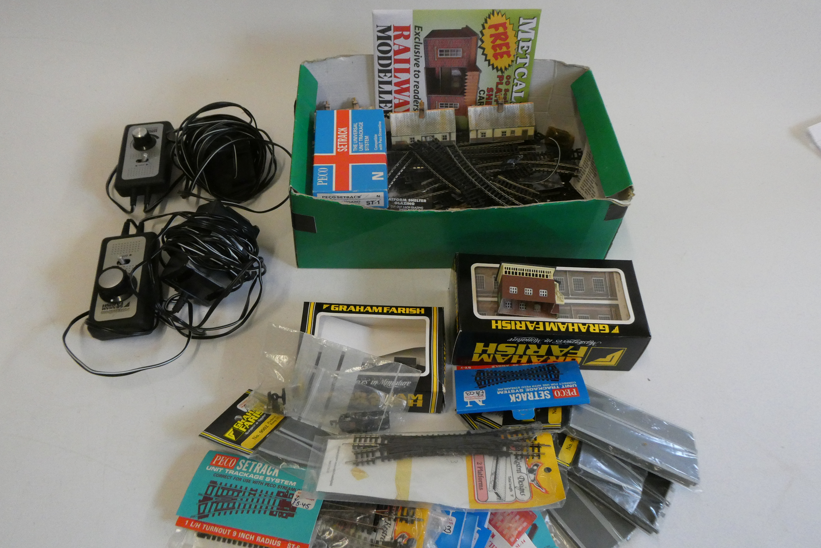 N gauge track and accessories including set track and point 12v controllers, trackside building and Image