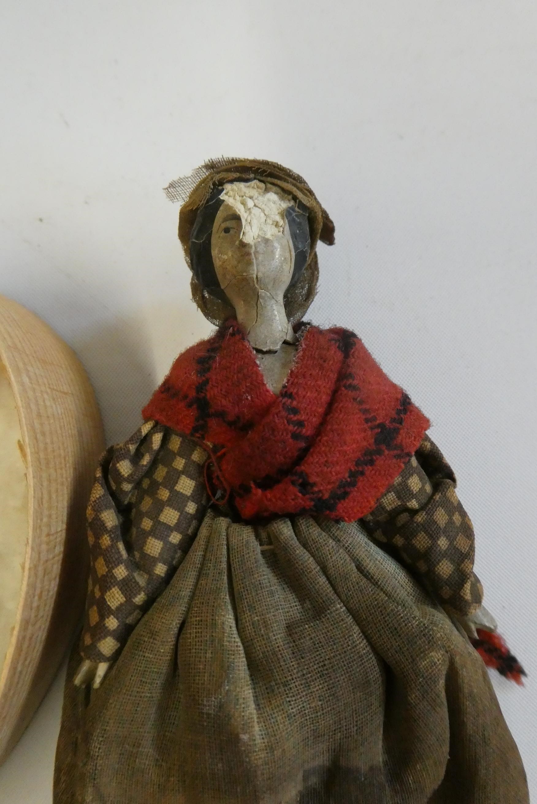 Three wooden piano dolls, c.1880, with painted features and jointed legs, largest 2 1/4" long, Image