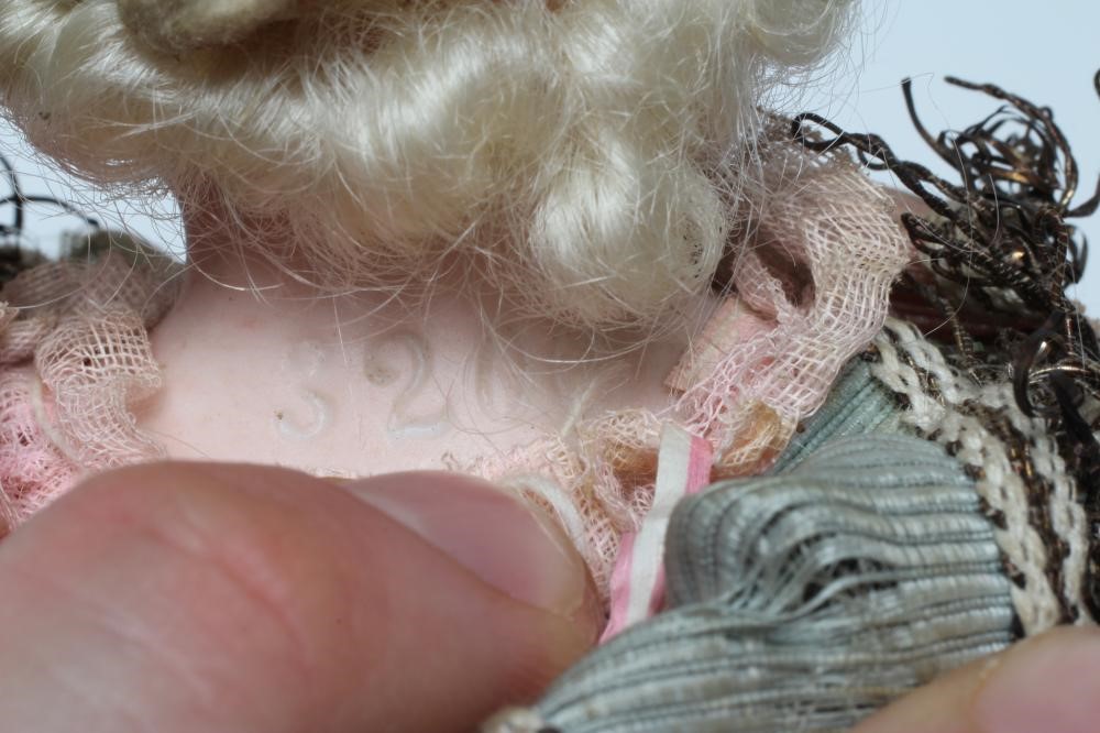 A Marotte bisque shoulder head doll, with blue glass fixed eyes, open mouth, teeth, blond wig, Image