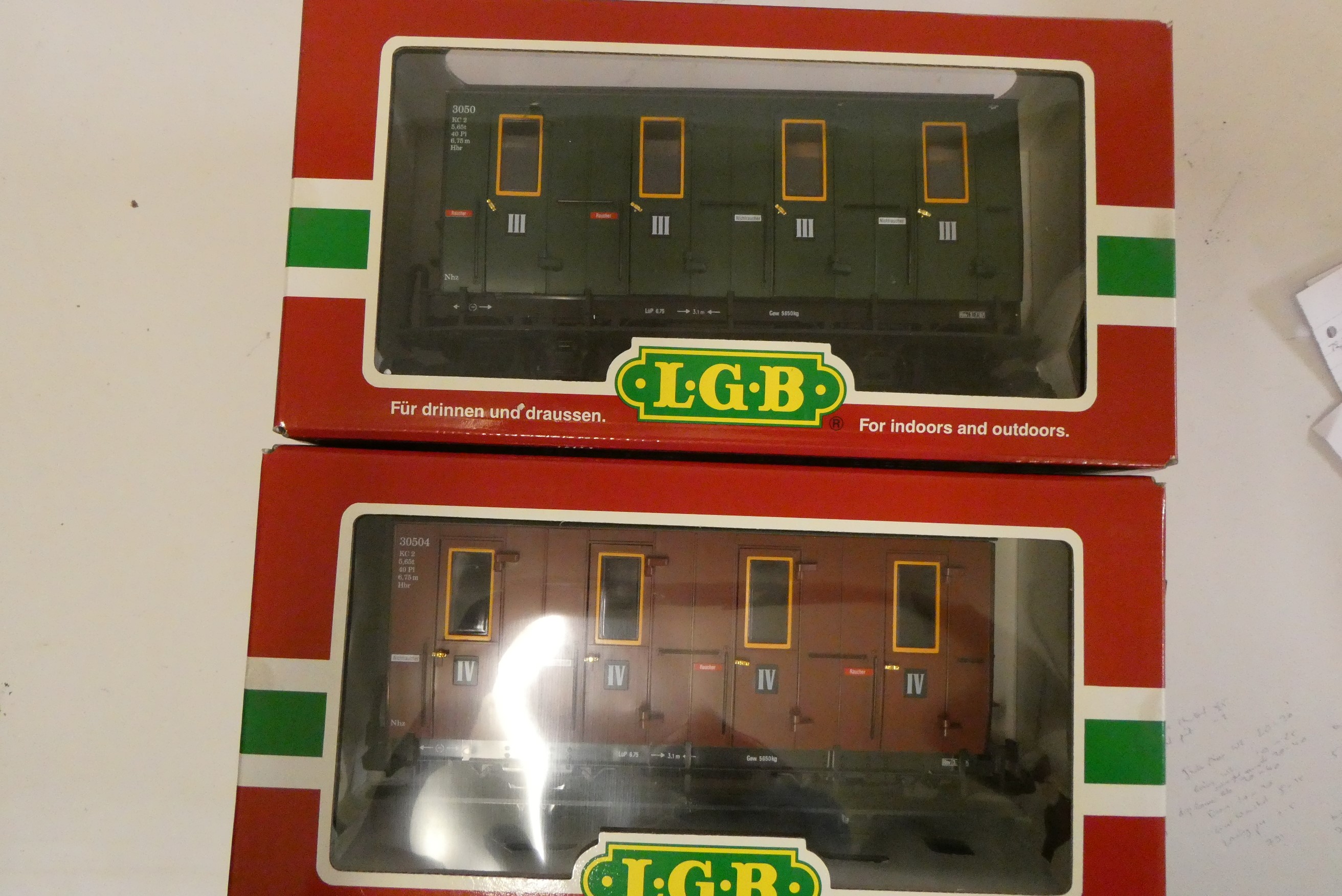 Three L.G.B models comprising 22130 0-4-2 locomotive, and two 4 wheel coaches, all items boxed, good Image