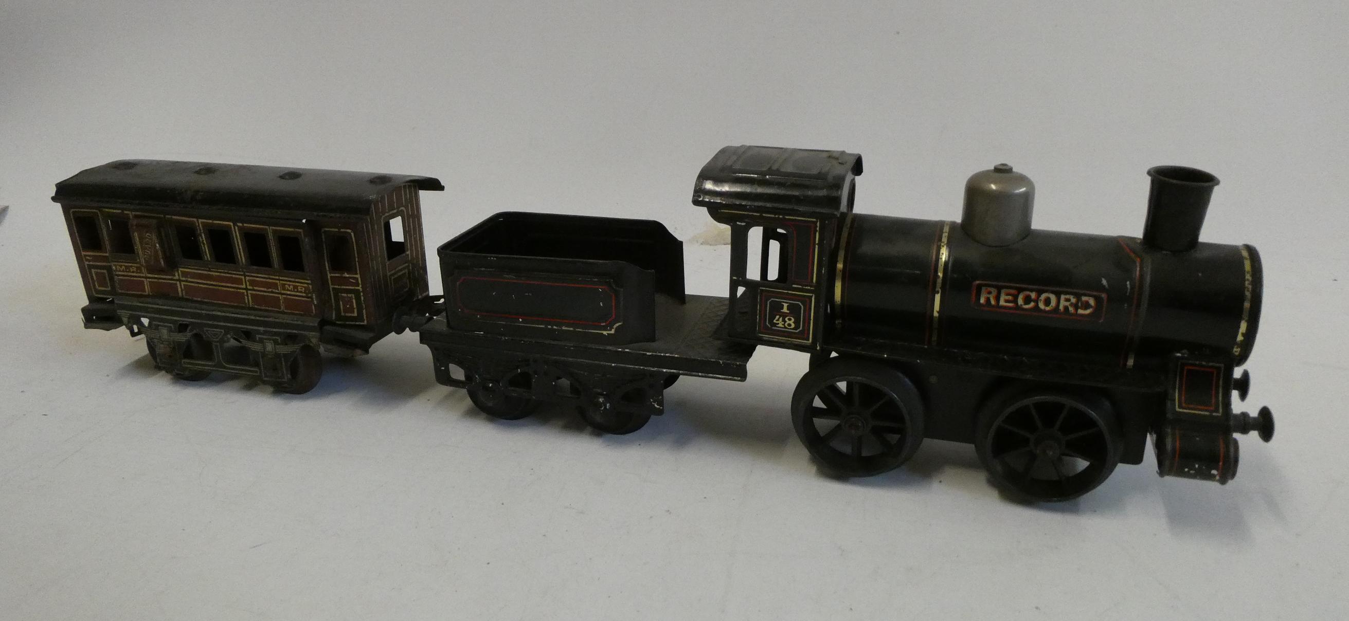 Bing gauge 1 clockwork locomotive record, condition is good, requires some cleaning, and an 0-gauge Image