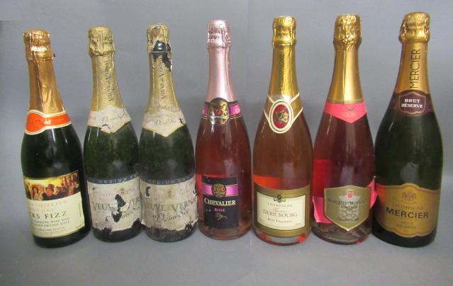 Seven bottles of sparkling wine Image