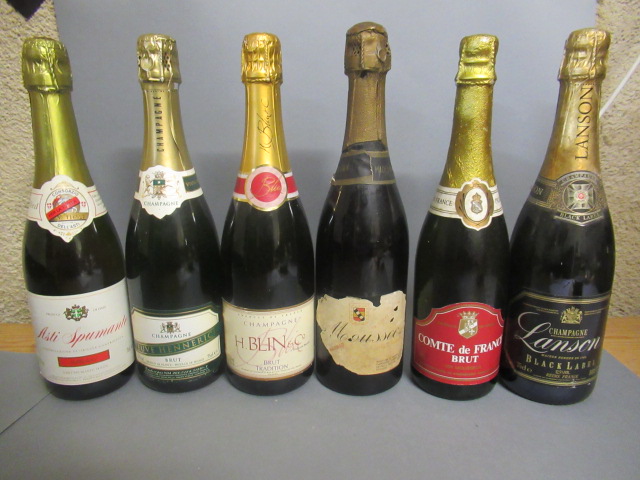 Six bottles of sparkling wine Image