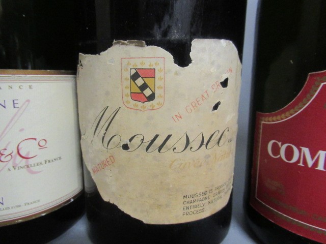 Six bottles of sparkling wine Image