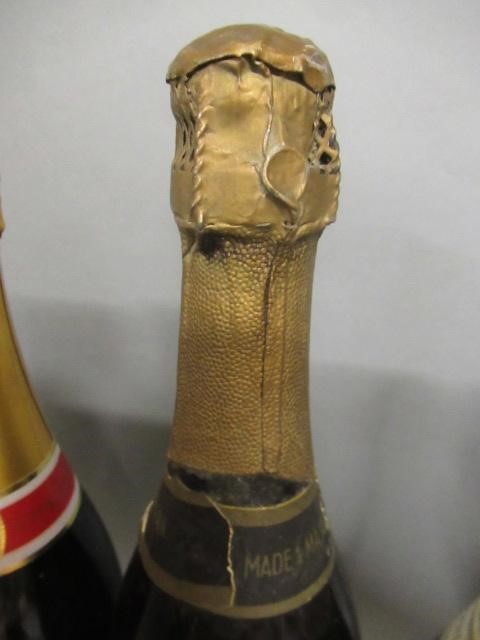 Six bottles of sparkling wine Image