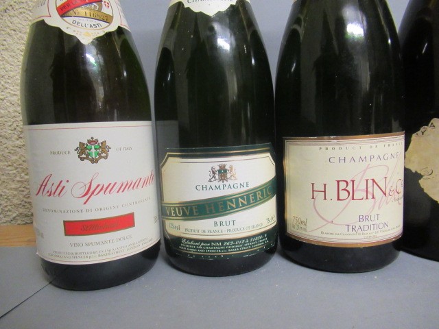 Six bottles of sparkling wine Image