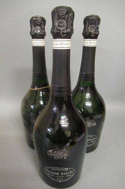 Three bottles Grand Siecle champagne Image