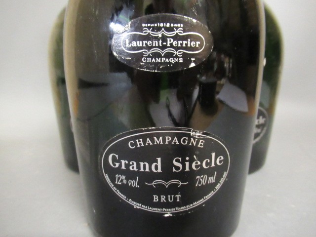 Three bottles Grand Siecle champagne Image