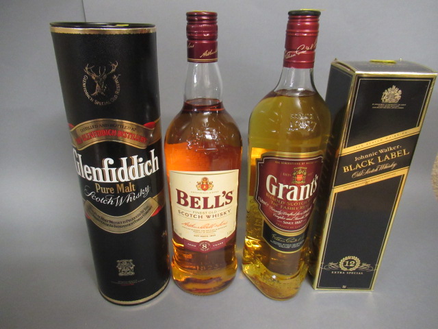 Four bottles of whisky Image