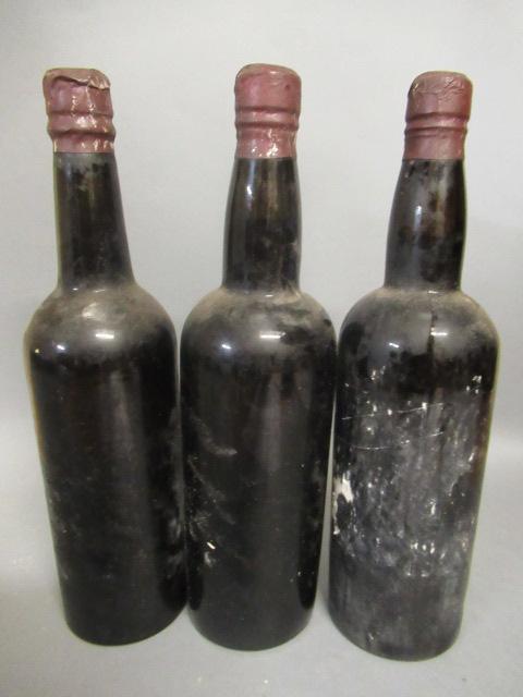 Three bottles of unknown port/spirits Image