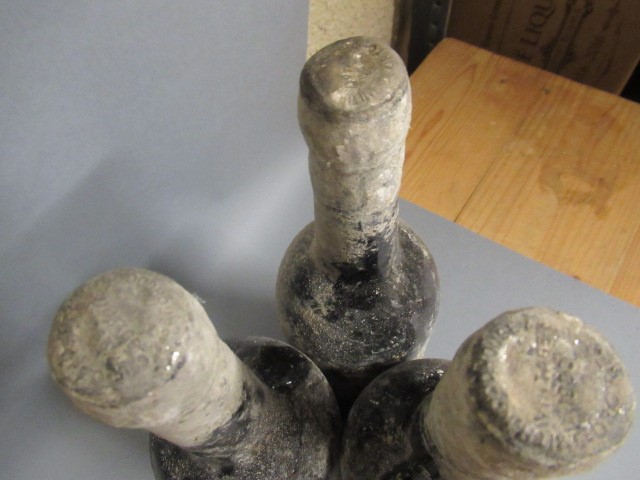 Four bottles of vintage port Image