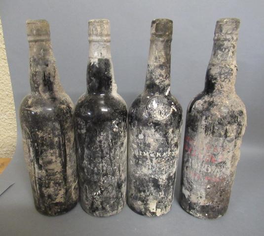 Four bottles of vintage port Image