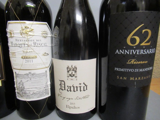 Six bottles of European and New World wines Image