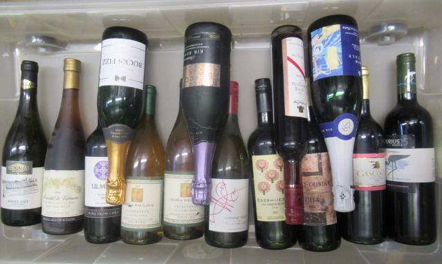 Thirteen bottles and one half bottle of European and New World wine Image