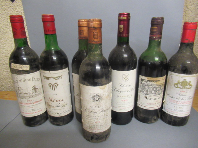 Seven bottles of Bordeaux Image