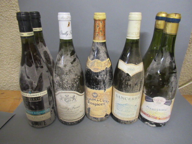 Seven bottles of white Burgundy Image