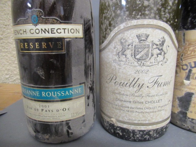 Seven bottles of white Burgundy Image
