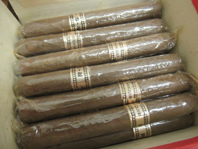 Three part filled boxes of cigars Image