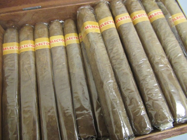 Three part filled boxes of cigars Image