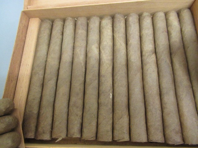 Three part filled boxes of cigars Image