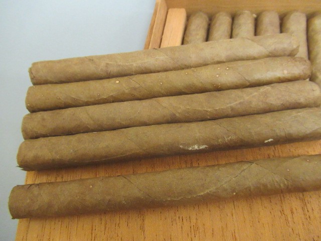 Three part filled boxes of cigars Image