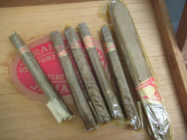 Three part filled boxes of cigars Image