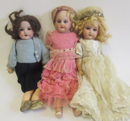 Three Armand Marseille bisque head dolls Image