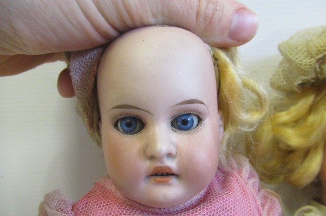 Three Armand Marseille bisque head dolls Image