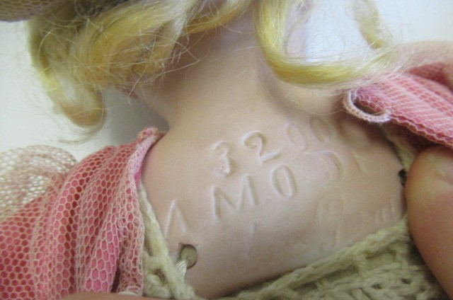 Three Armand Marseille bisque head dolls Image