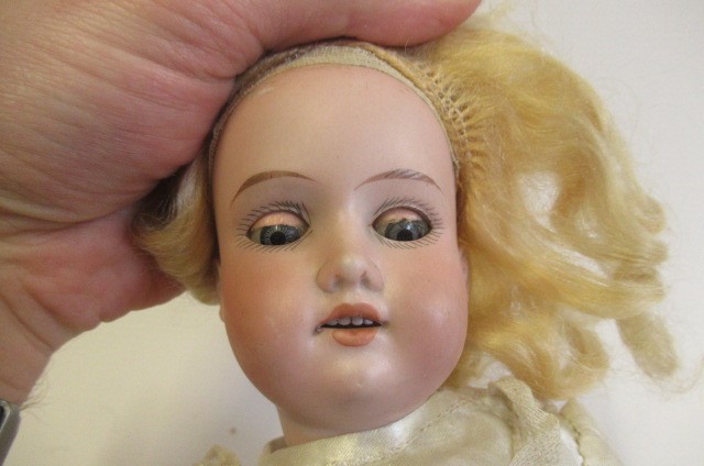 Three Armand Marseille bisque head dolls Image