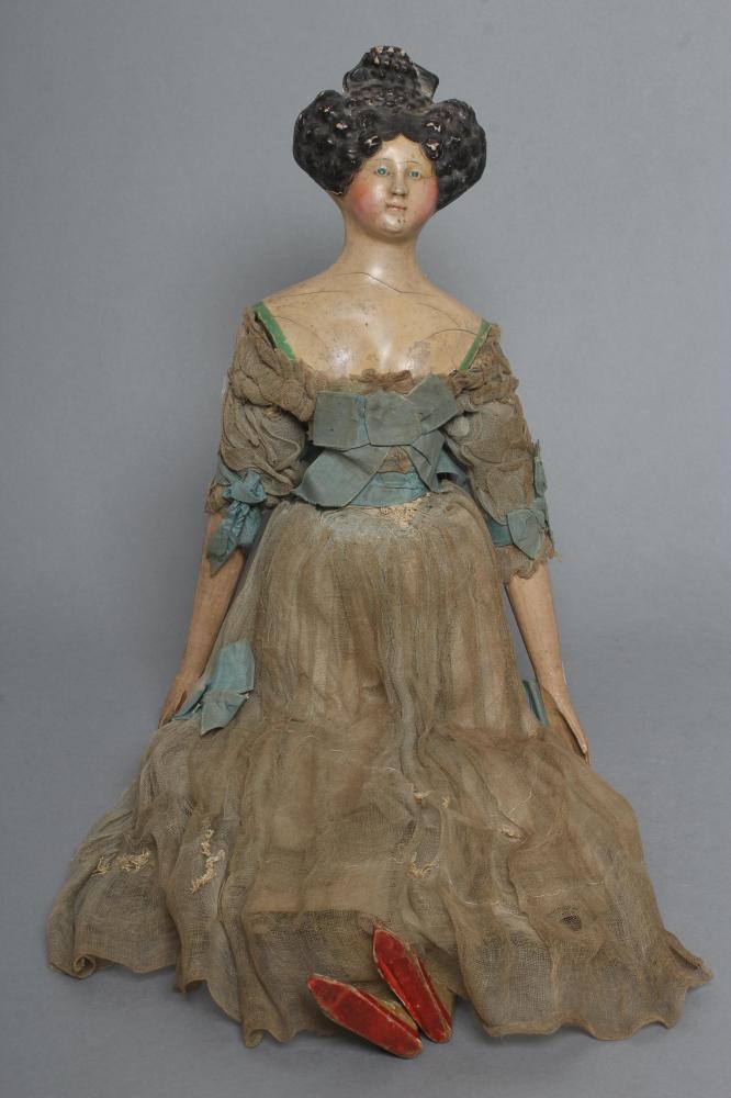 A papier mache doll Image