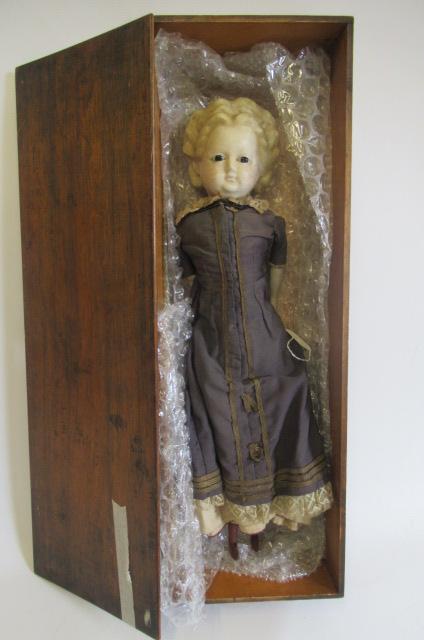 A wax "pumpkin head" doll Image