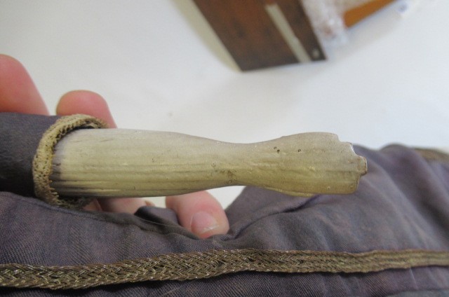 A wax "pumpkin head" doll Image