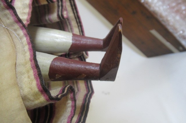 A wax "pumpkin head" doll Image