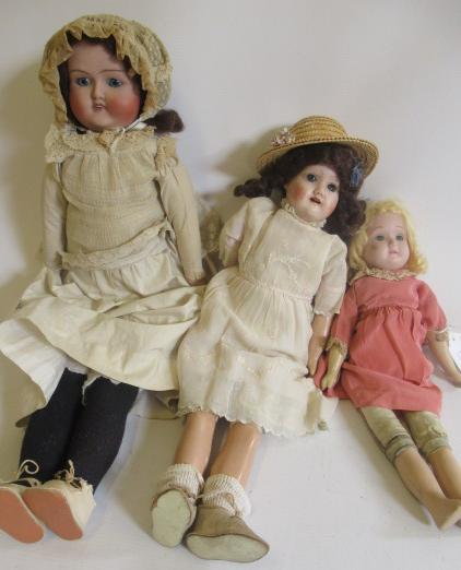 Three English bisque shoulder head dolls Image
