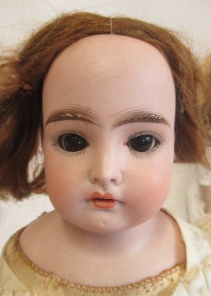 Two Armand Marseille bisque shoulder head dolls Image