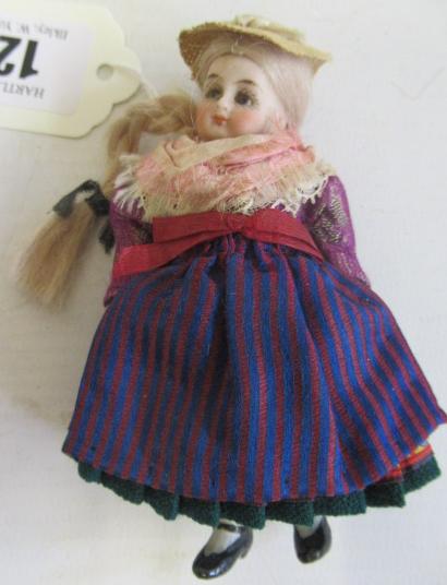 A bisque socket head doll's house doll Image
