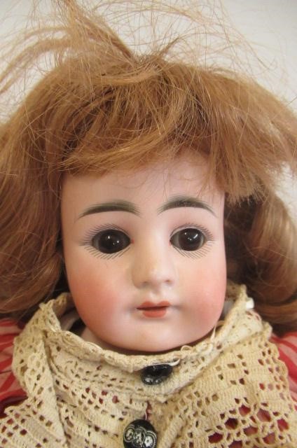 A German bisque shoulder head doll Image