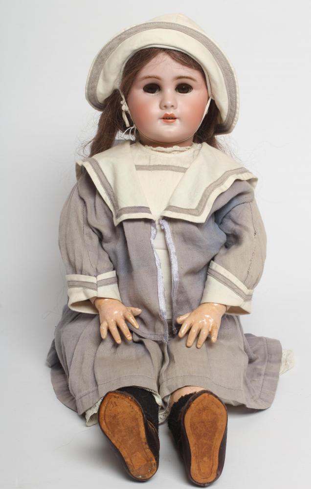 A Bebe Jumeau bisque socket head doll Image