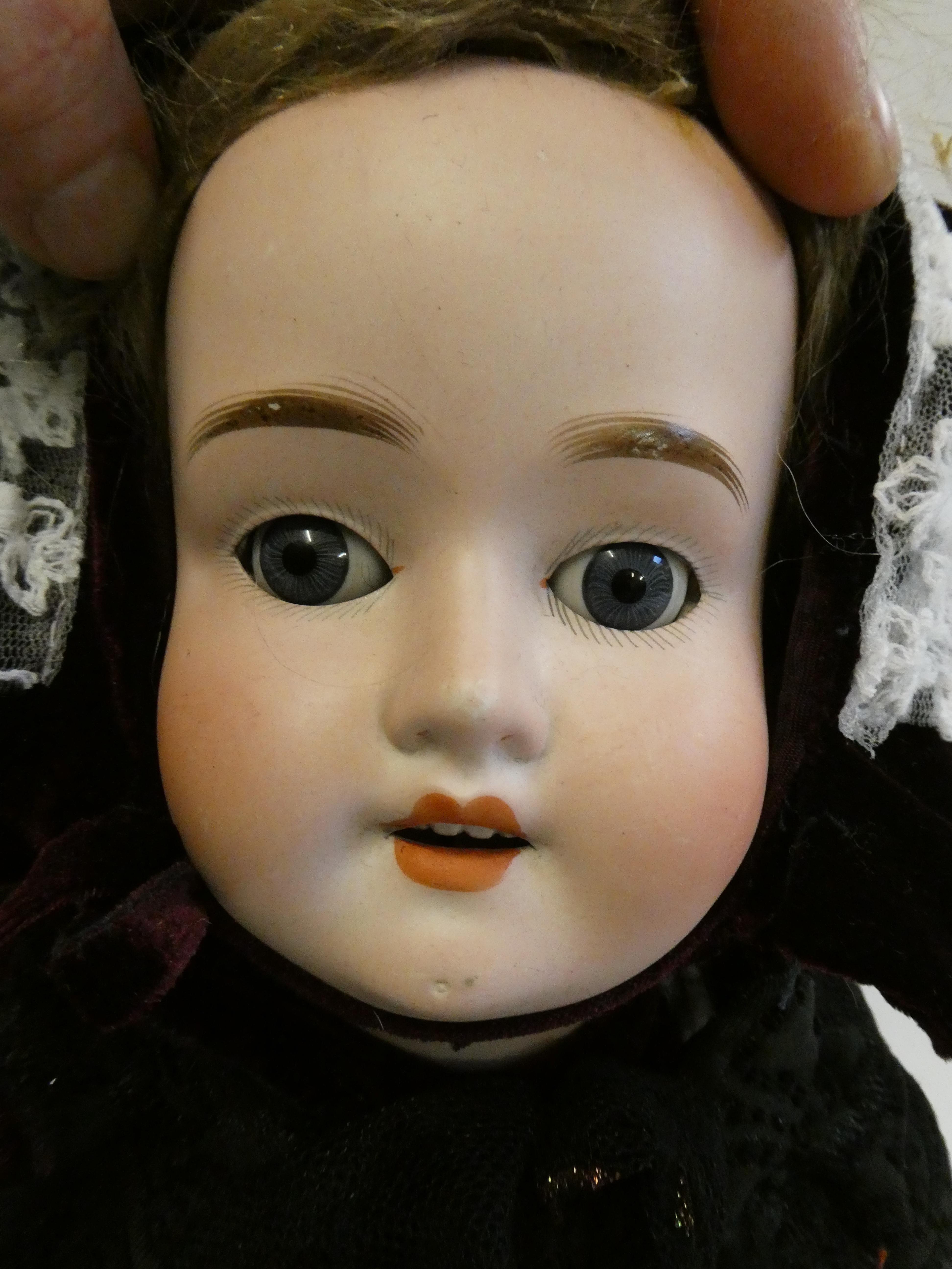 A Schoenau & Hoffmeister bisque socket head doll Image