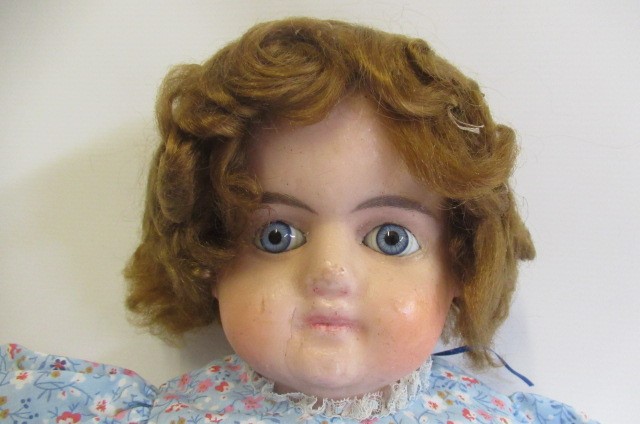 A large Victorian wax shoulder head doll Image