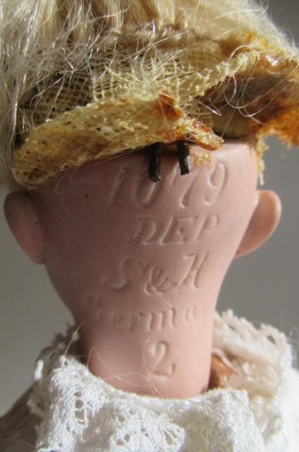 A Simon & Halbig bisque socket head doll Image