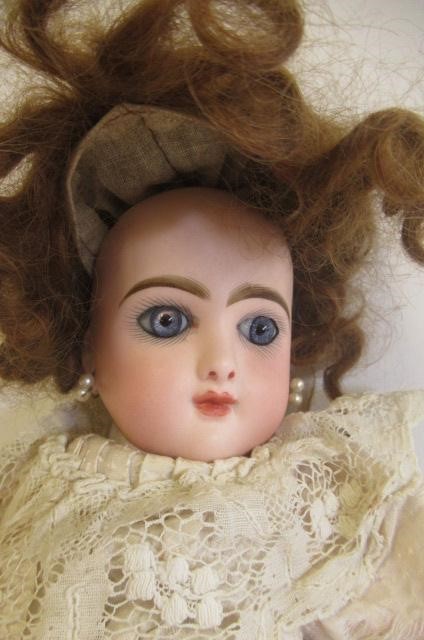 A Bebe Jumeau bisque socket head doll Image