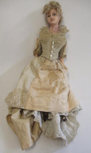 A Victorian wax shoulder head doll Image
