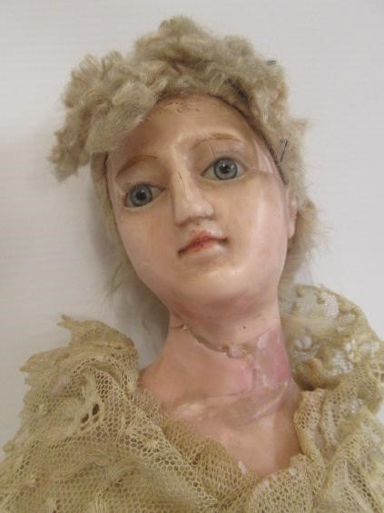 A Victorian wax shoulder head doll Image