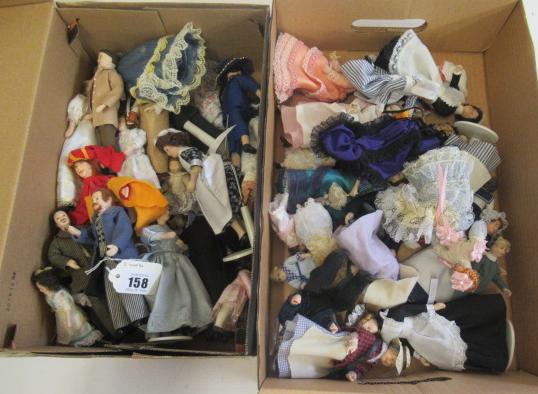 Two boxes of doll's house dolls Image