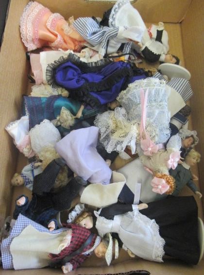 Two boxes of doll's house dolls Image