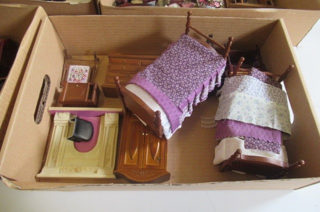 A large collection of modern doll's house furniture and decoration Image